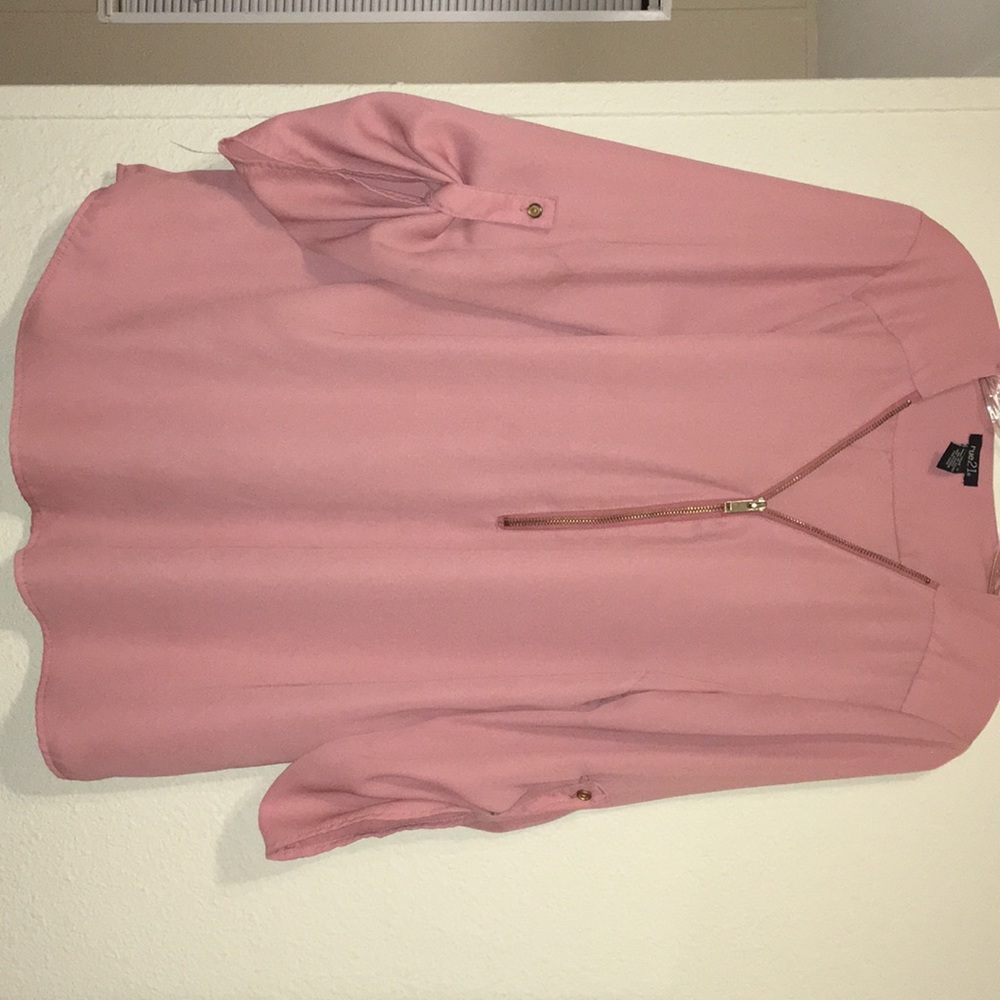 Flowy blush colored top.